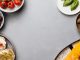 Fresh ingredients with sandwiches in a flat lay style, offering a gourmet meal concept.